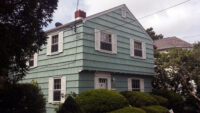 This is the original house. There were no overhangs, there was no porch, the landscaping was overgrown, and the entire side yard was driveway. Before