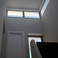 The interior of the stair tower looking up as you come up. YOu can see the ribbon window just below the roof to allow light in or out and the door to the elevator and the door to the side balcony. Stair Tower Interior