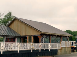 The exterior of the addition from a distance. We attached this pavillion to the existing structure and aligned the new roof to the existing.