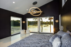 The view out from the primary bedroom, overlooking the pond.